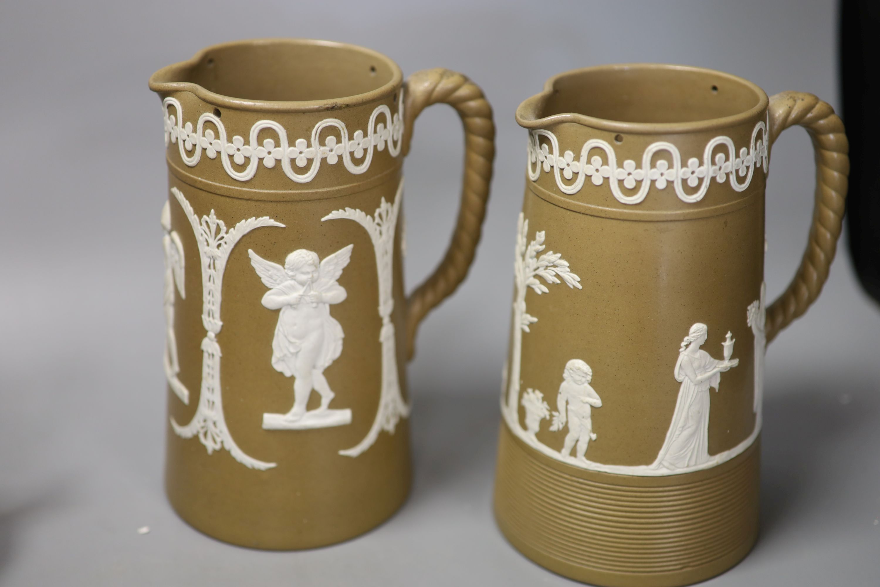 A 19th century Wedgwood teapot and jug, two black basalt jugs and a mug and two drabware jugs, tallest 18cm